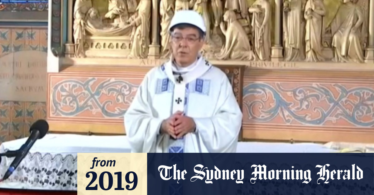 Video Priests wear hard hats for Notre Dame mass
